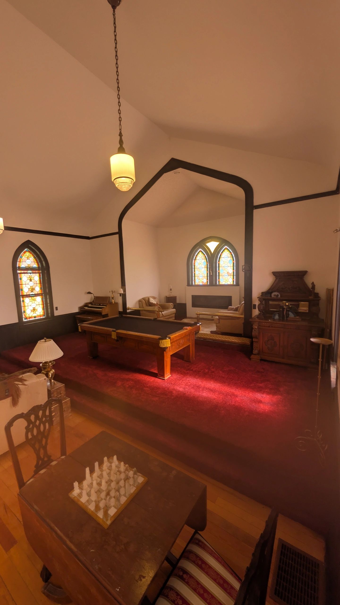 Chapel interior with stained glass and vaulted ceiling