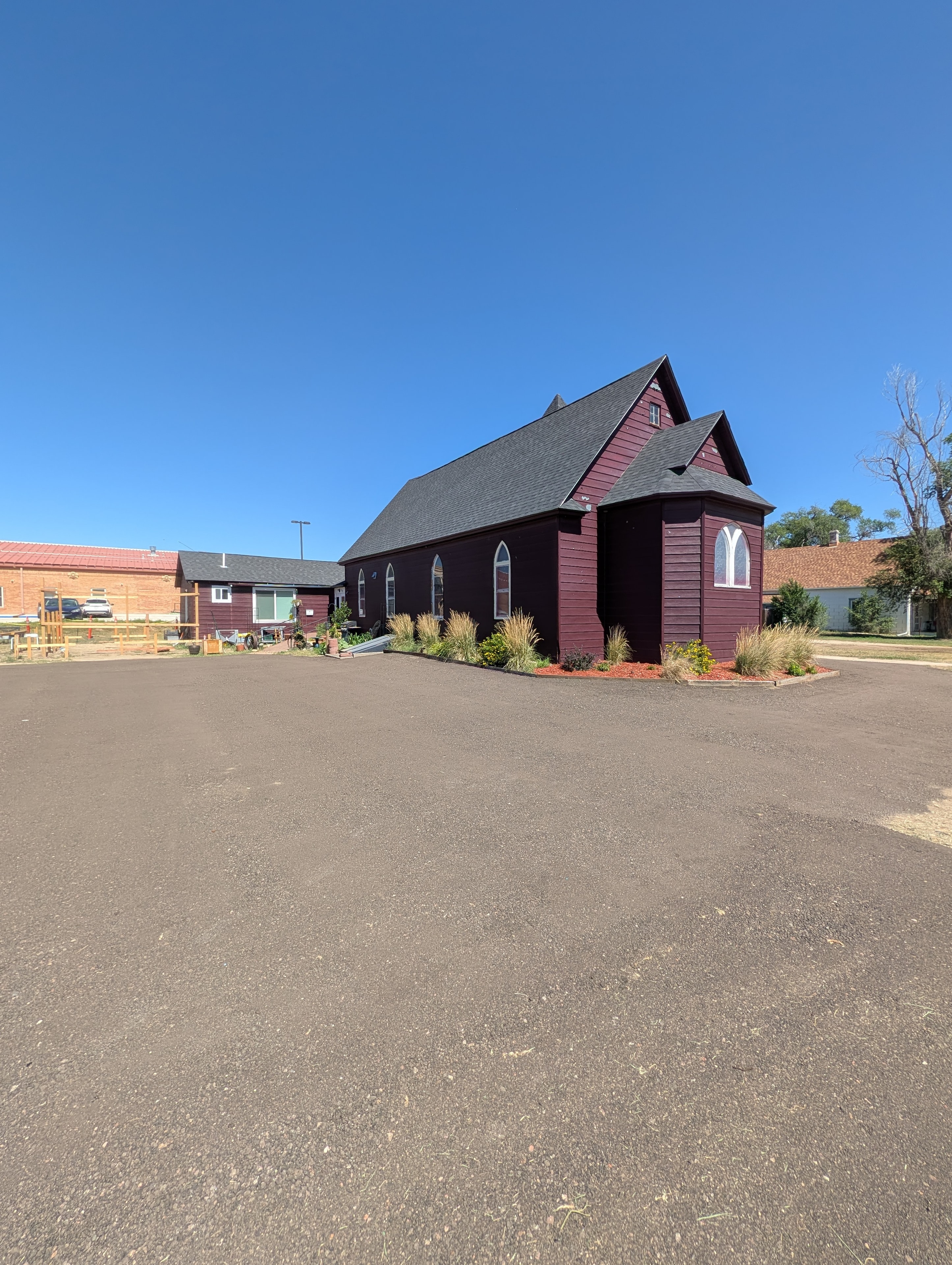 Chapel exterior side view with parking lot