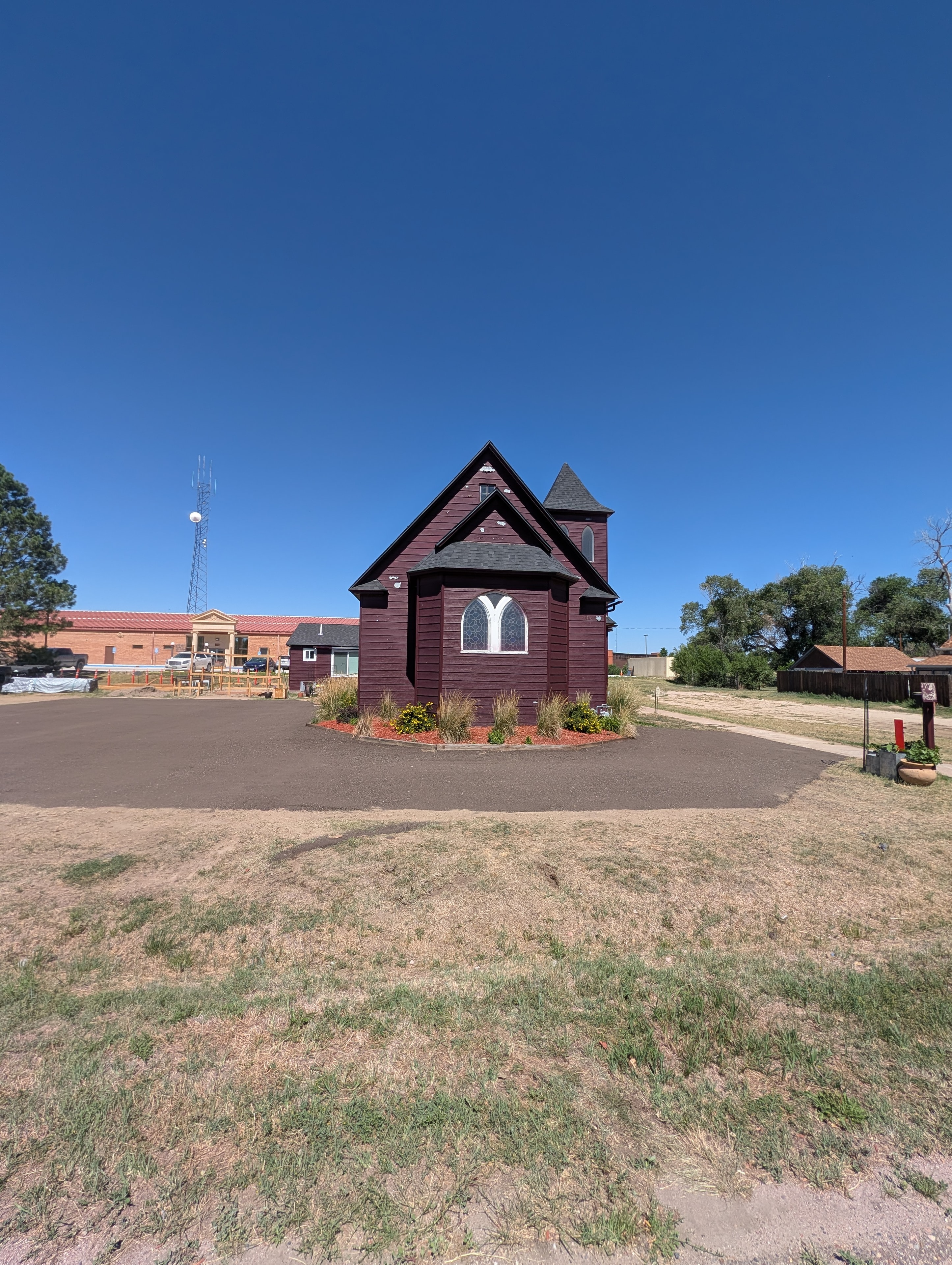 Chapel front view with steeple and arched windows