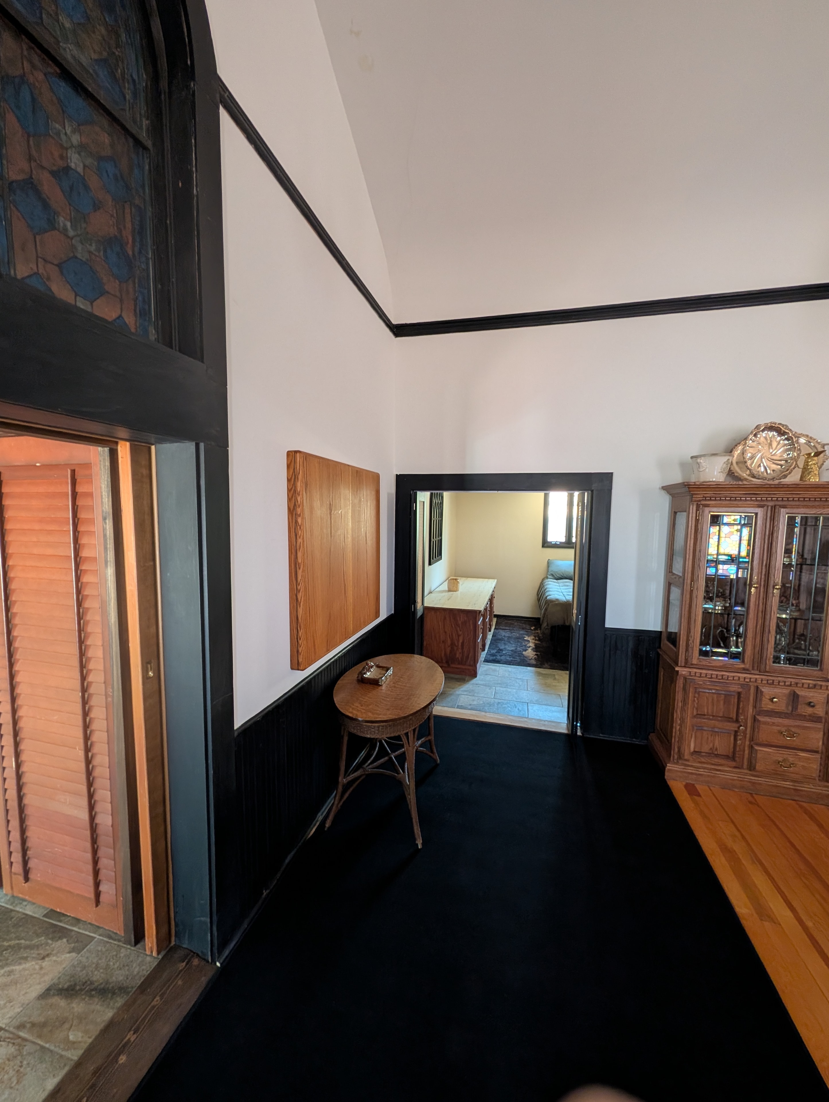 Chapel interior foyer with stained glass and wainscoting