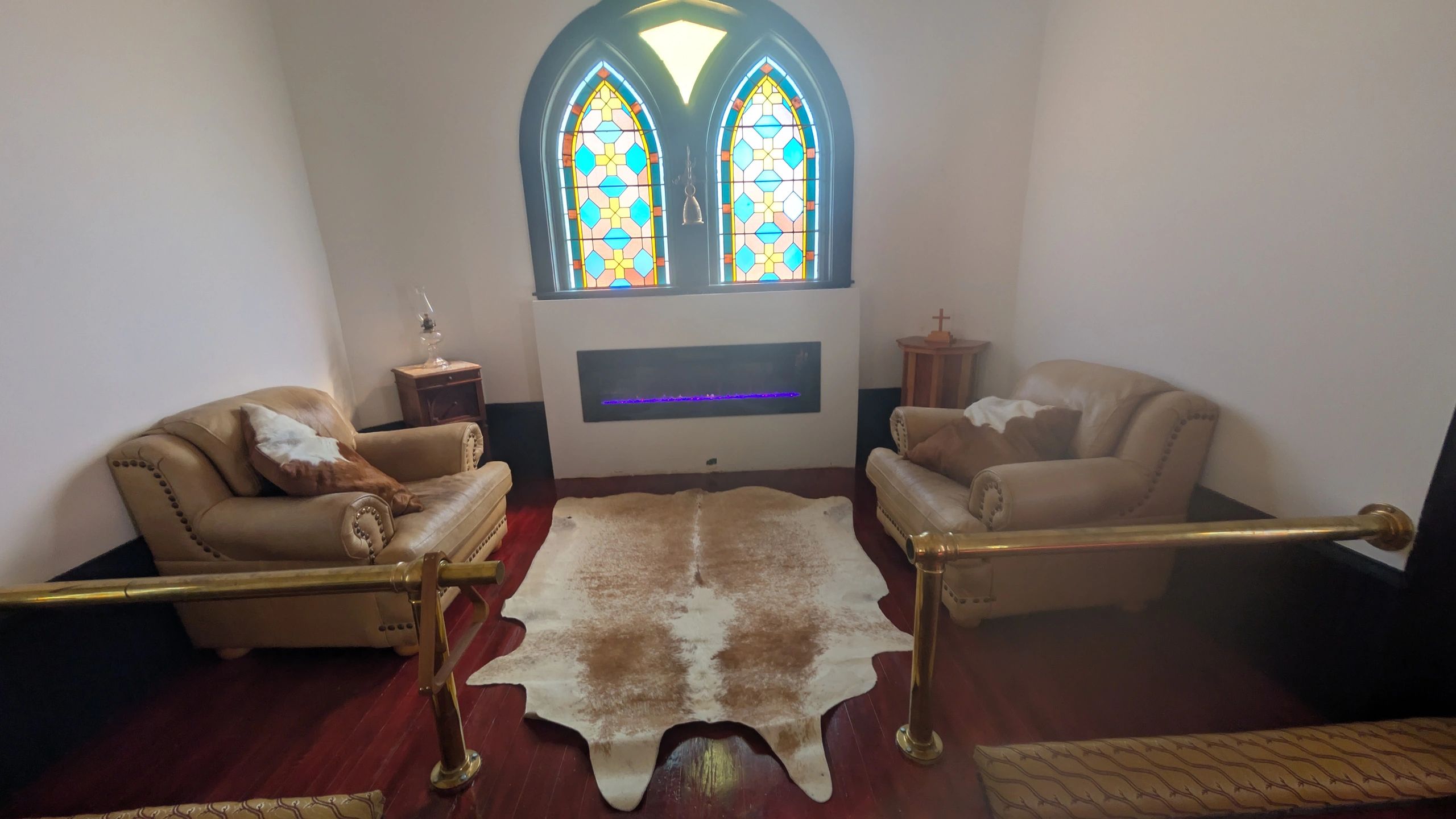 Stained glass windows with armchairs